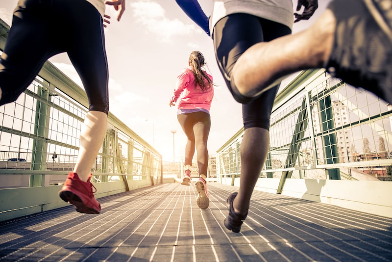 Three runners outdoors in an urban area